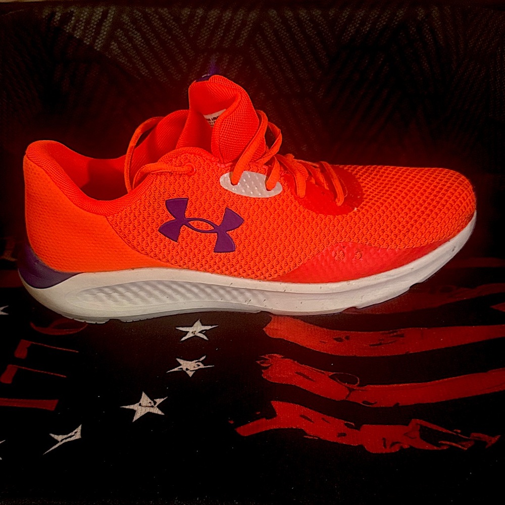 Under Armour neon orange with purple logo.